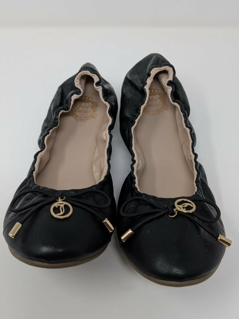 Juicy Couture Black logo embossed ballerina stretch shoes with bow and charm